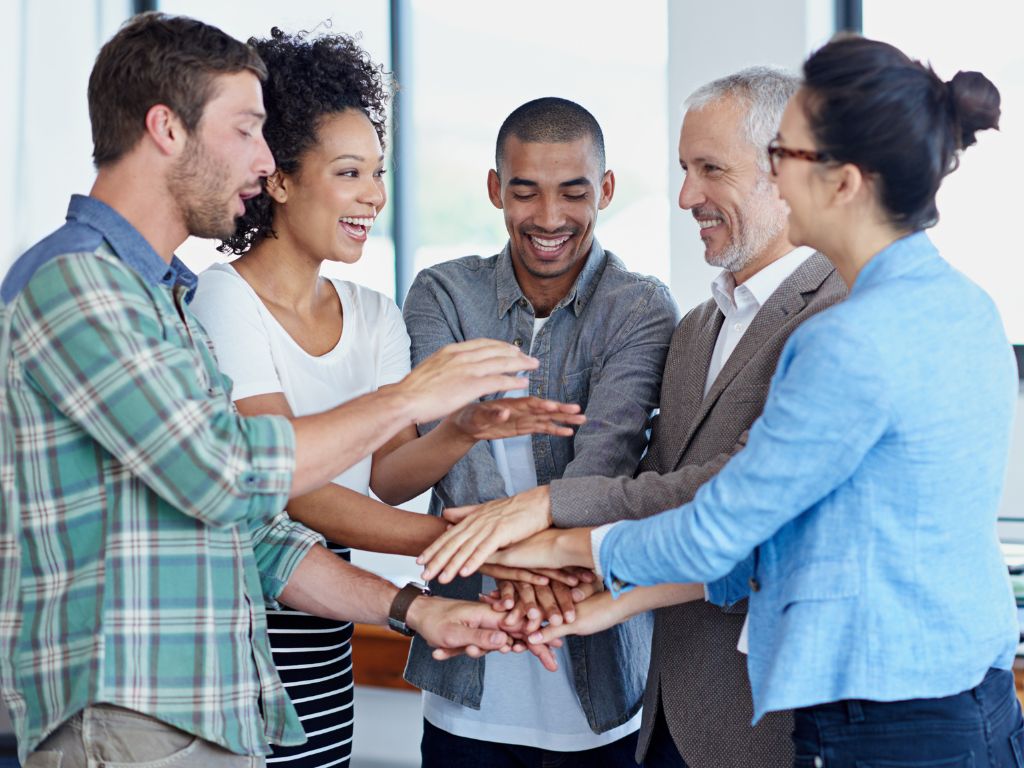 Happy Team Members And Leader Continuously Improve As A Leader